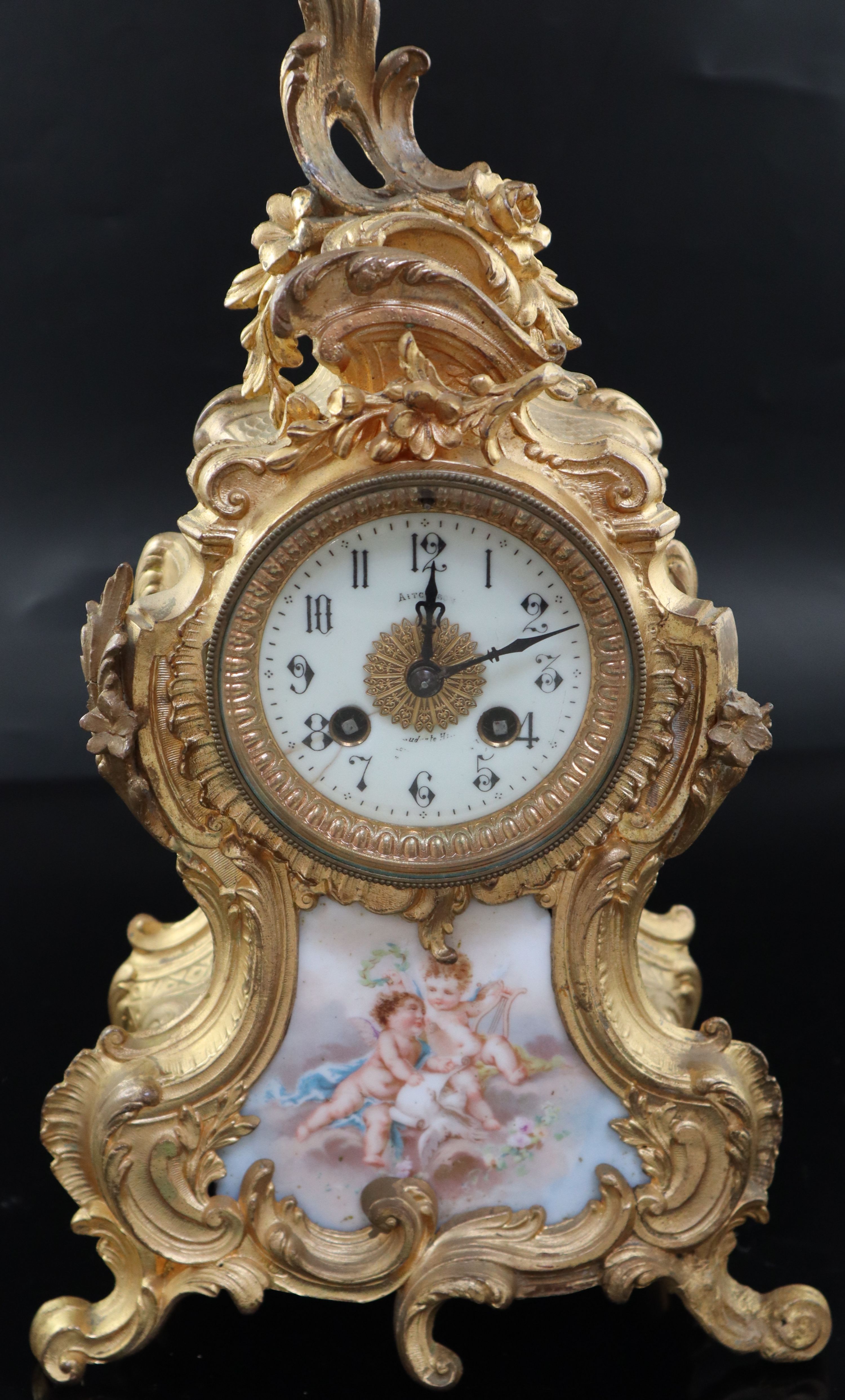 An early 20th century French gilt metal and porcelain eight day mantel clock, height 37cm